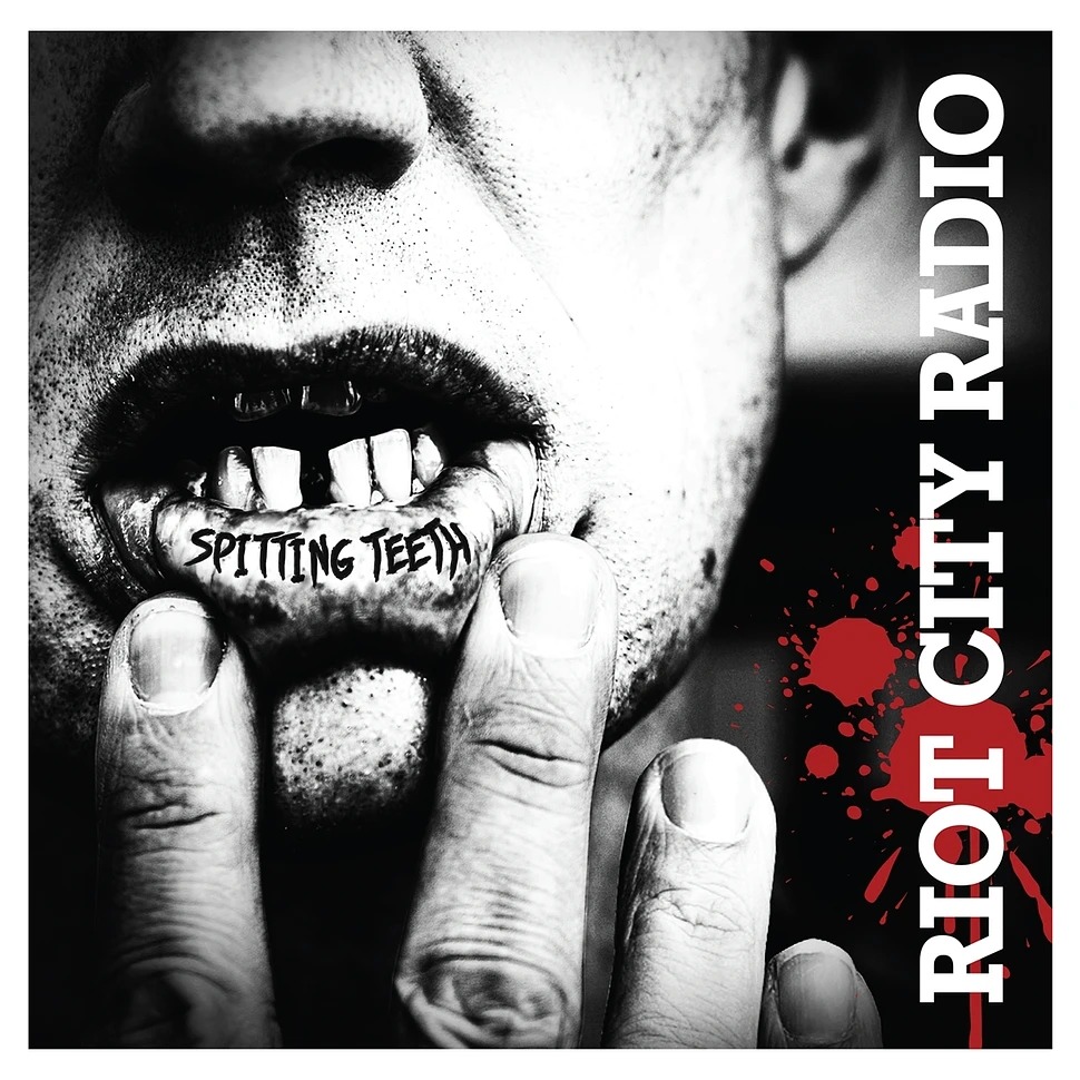 Riot_City_Radio_-_Spitting_Teeth_Red_With_BlackNWhite_Splatter_Vinyl_Edition.jpeg